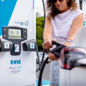 Woman charging car at EV Charging Station